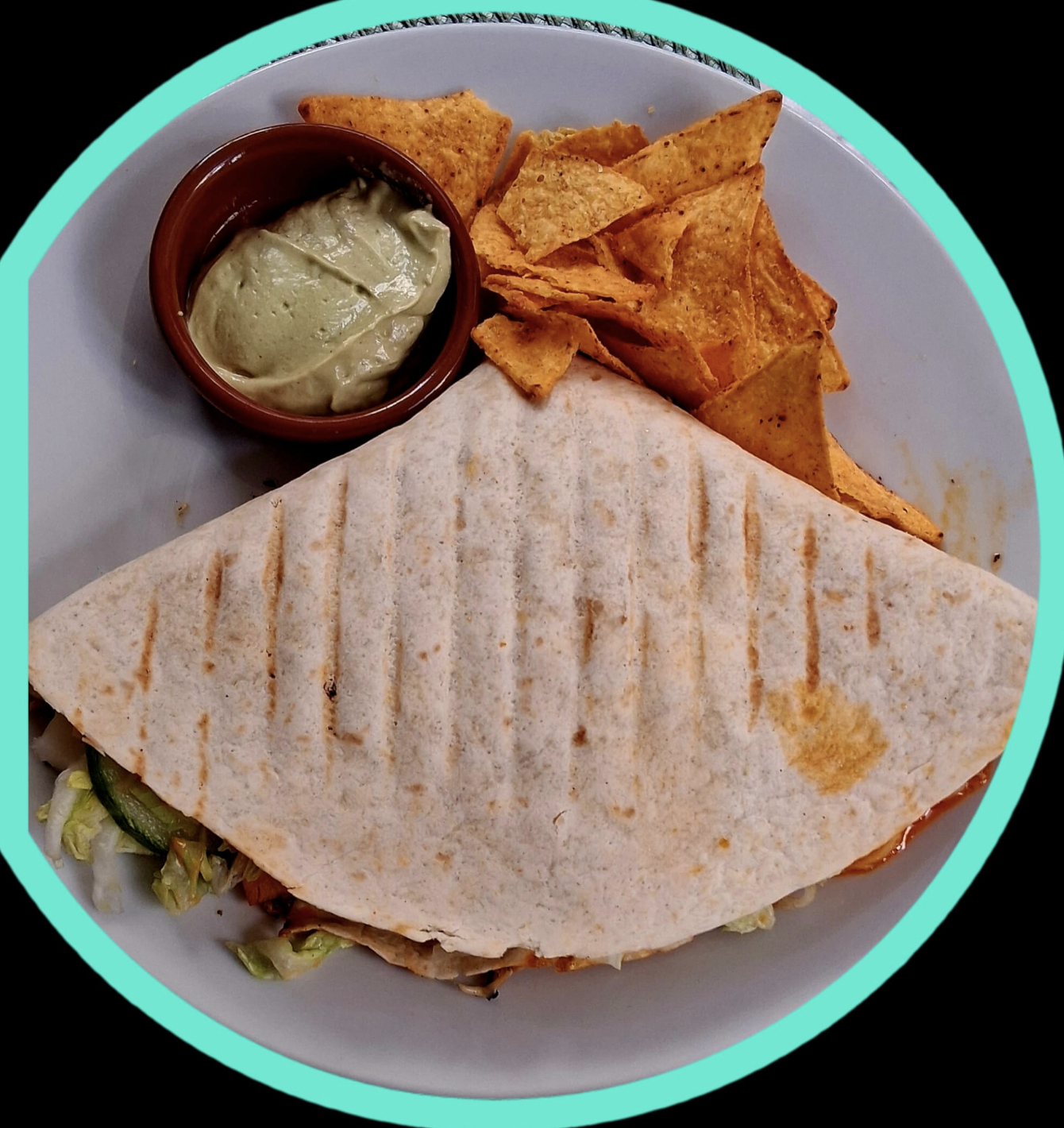 Quesadilla served with chips and dip